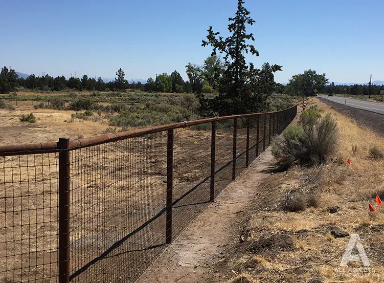 All Aspects Pipe Fencing with Black Woven Wire Central Oregon