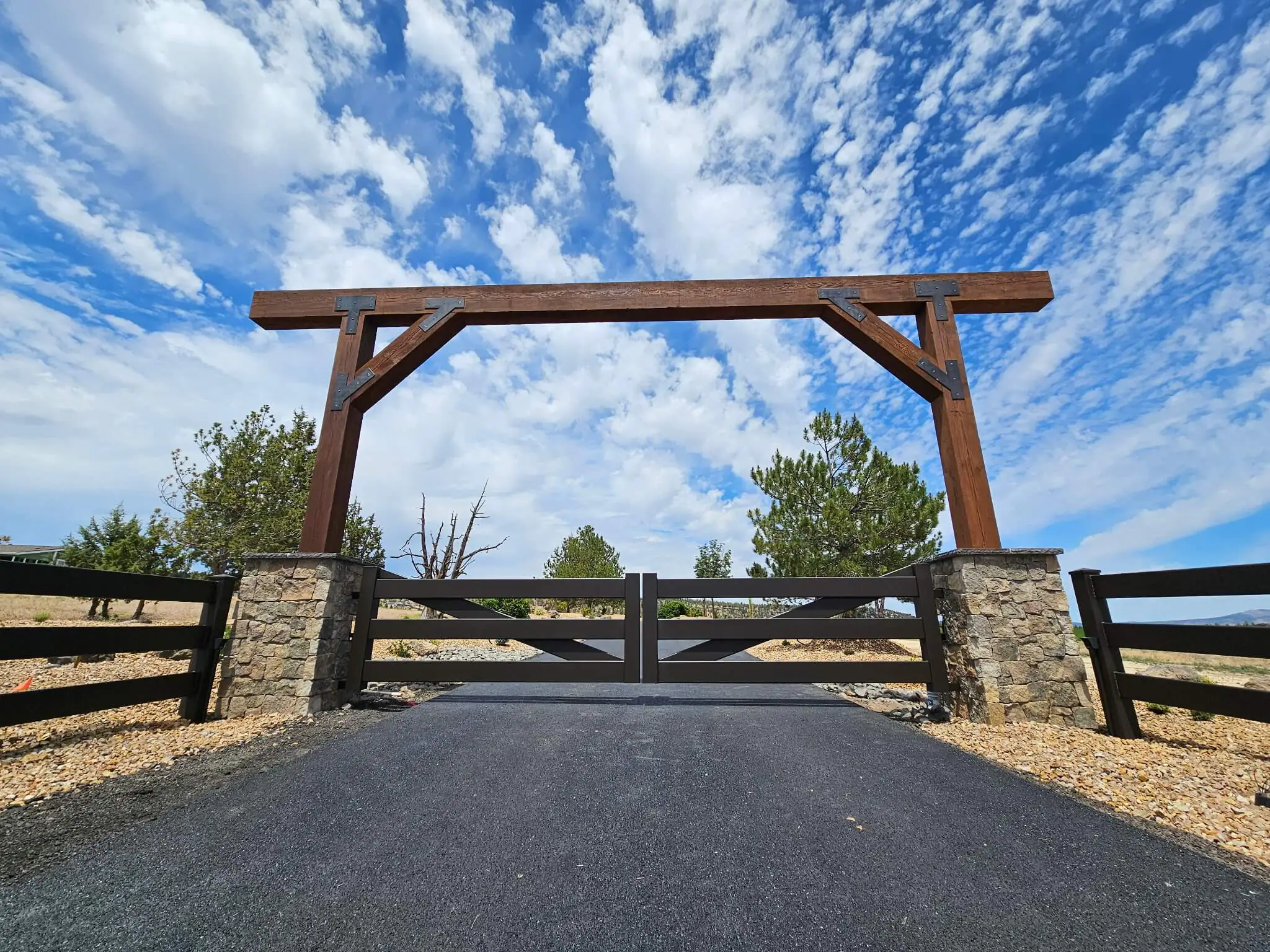 Driveway entrance archway with gate Central Oregon